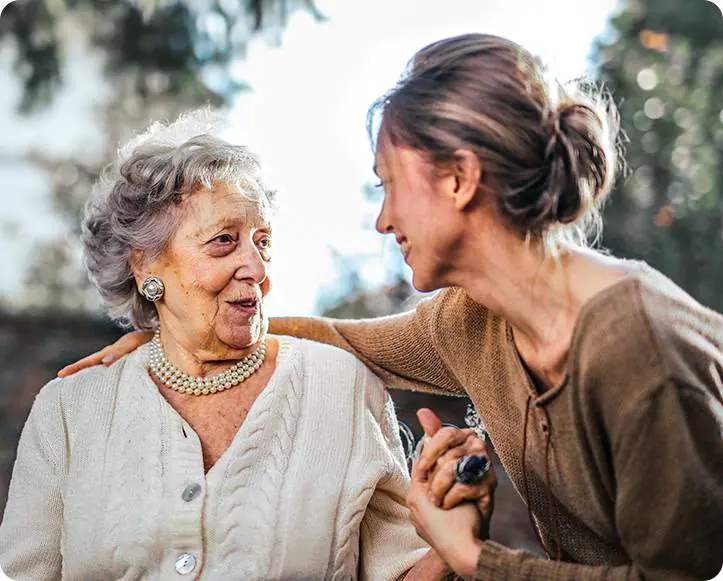 Elderly woman with caregiver who is giving dementia care in Edmonton.