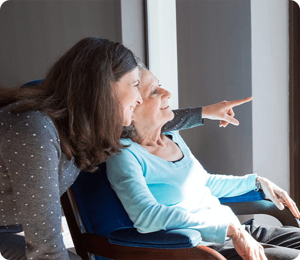 Elderly woman talking to a palliative caregiver in Edmonton.